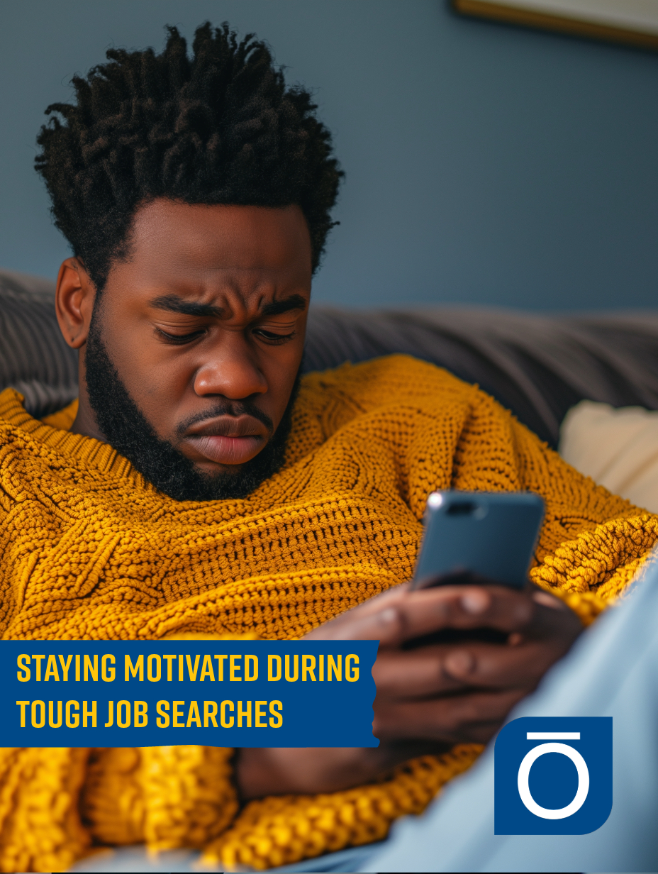 Man in a yellow sweater frowning at his phone, reflecting the challenge of staying motivated during job searches.